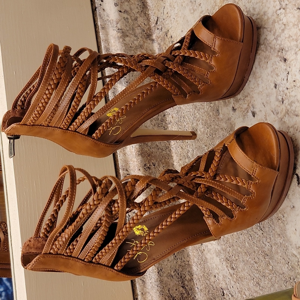 Stacked high heels ,size 7.5b USA sizing. Brand new never worn.